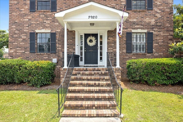2920 Arrowhead Dr, Augusta, GA 30909 - property entrance with brick siding and a yard