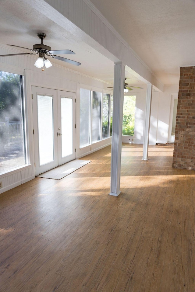 337 Patton Ct, Martinez, GA 30813 - unfurnished living room featuring a ceiling fan, wood finished floors, french doors, and crown molding