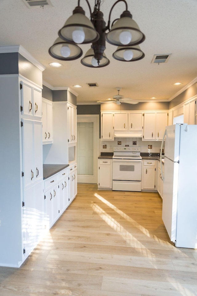 337 Patton Ct, Martinez, GA 30813 - kitchen with white appliances, crown molding, dark countertops, light wood finished floors, and recessed lighting