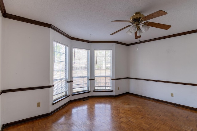 empty room featuring ceiling fan, crown molding, baseboards, and a textured ceiling