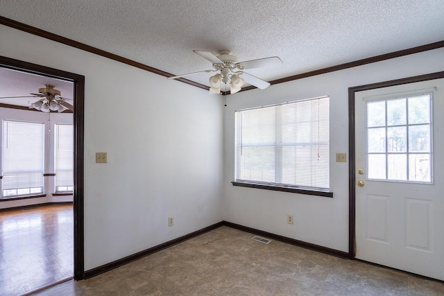 interior space featuring visible vents, a textured ceiling, crown molding, and a ceiling fan