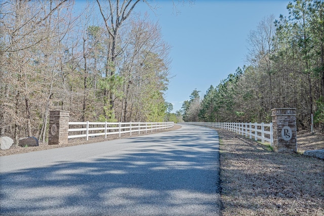 1021 S Pointe Ct, Tignall, GA 30668 - view of asphalt street with a wooded view