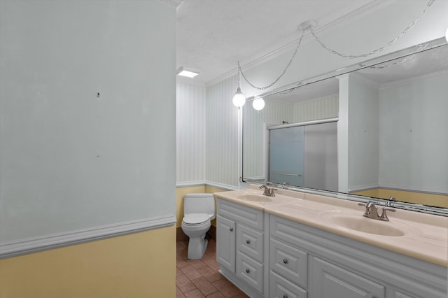 4558 Glenda Ln, Evans, GA 30809 - bathroom with double vanity, toilet, a shower with door, crown molding, and a textured ceiling