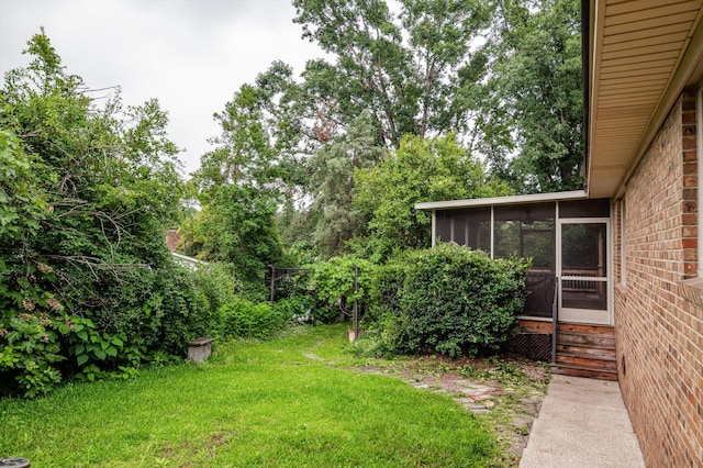 4558 Glenda Ln, Evans, GA 30809 - view of grassy yard with a sunroom and entry steps