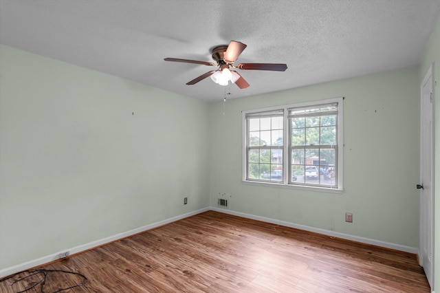 4558 Glenda Ln, Evans, GA 30809 - unfurnished room with a ceiling fan, wood finished floors, and baseboards