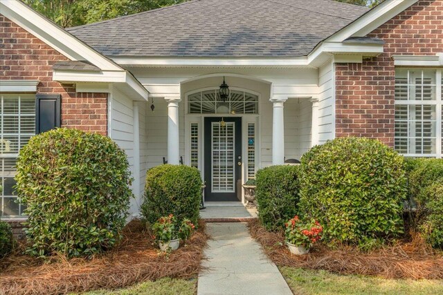 900 Mitchell Ln, Evans, GA 30809 - view of exterior entry featuring brick siding and a shingled roof