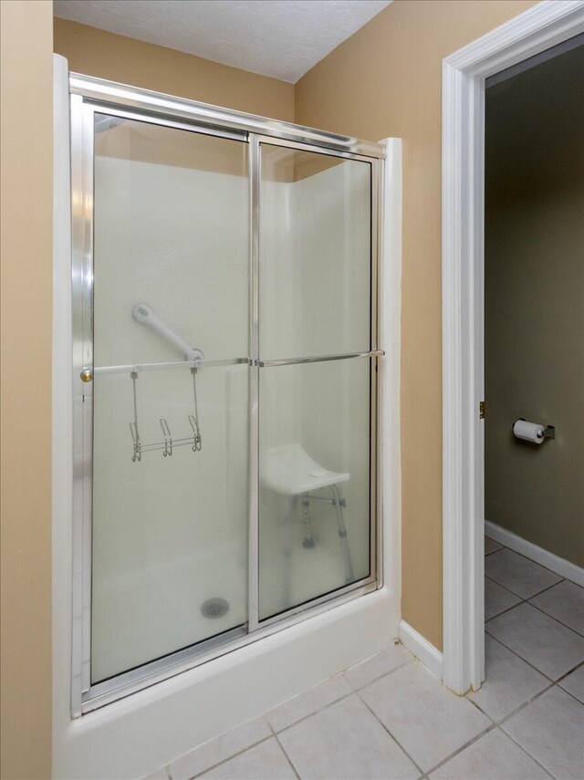 900 Mitchell Ln, Evans, GA 30809 - full bath featuring tile patterned floors, a stall shower, and baseboards