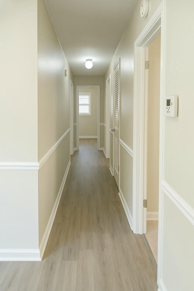 4612 Dunbarton Dr, Hephzibah, GA 30815 - corridor featuring light wood finished floors and baseboards