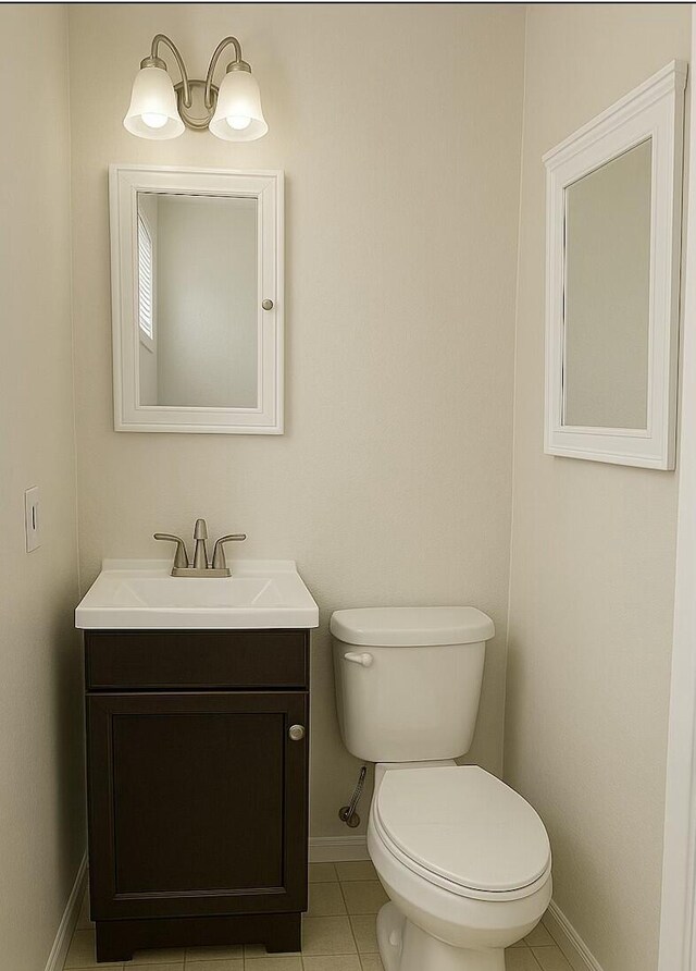 4612 Dunbarton Dr, Hephzibah, GA 30815 - half bath featuring toilet, tile patterned flooring, baseboards, and vanity