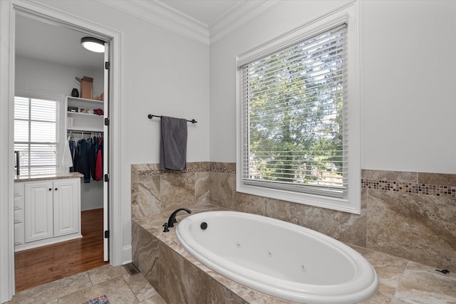 5099 Grande Park, Evans, GA 30809 - full bath with crown molding, a tub with jets, a walk in closet, and plenty of natural light