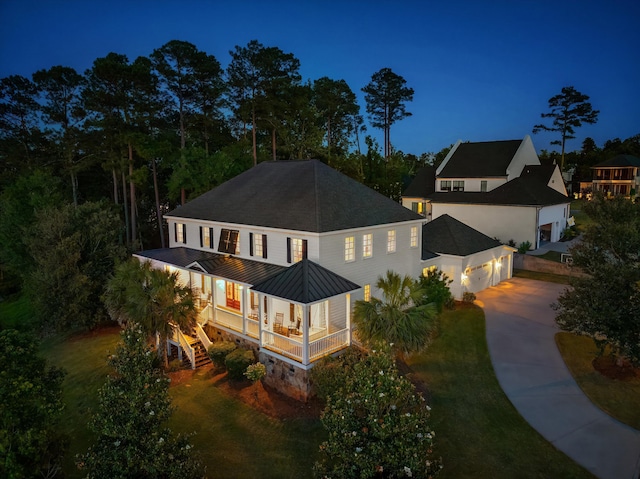 5099 Grande Park, Evans, GA 30809 - back of house featuring a standing seam roof, concrete driveway, metal roof, a garage, and a yard