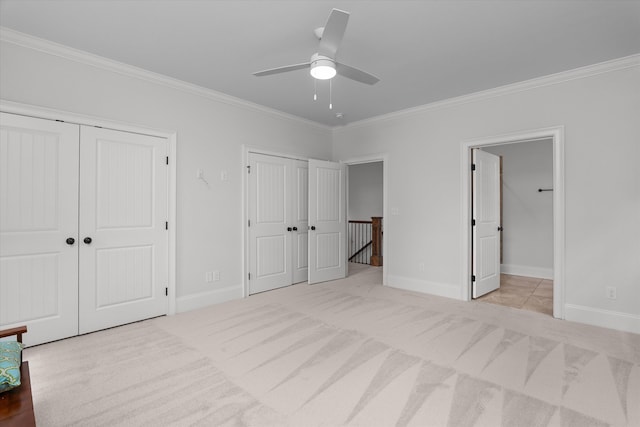 5099 Grande Park, Evans, GA 30809 - unfurnished bedroom featuring two closets, ornamental molding, carpet floors, baseboards, and connected bathroom