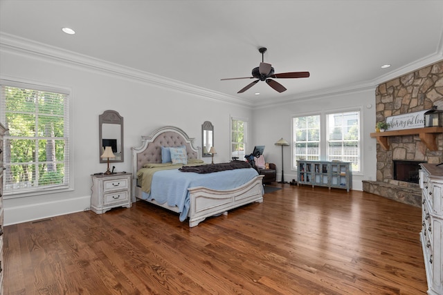 5099 Grande Park, Evans, GA 30809 - bedroom featuring a fireplace, wood finished floors, crown molding, ceiling fan, and baseboards