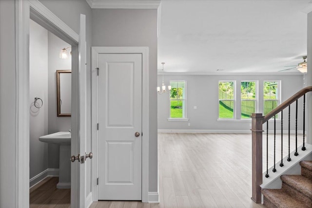 5051 Anna Way Unit Fb23, North Augusta, SC 29841 - corridor featuring stairway, light wood-type flooring, a chandelier, and ornamental molding