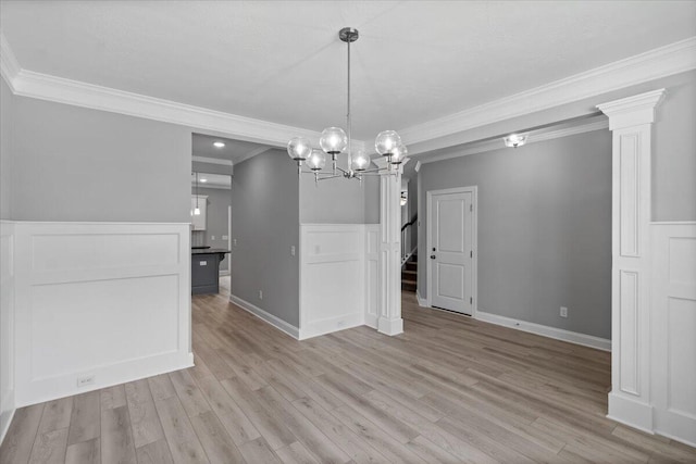 5051 Anna Way Unit Fb23, North Augusta, SC 29841 - unfurnished dining area with crown molding, a chandelier, light wood-type flooring, wainscoting, and a decorative wall