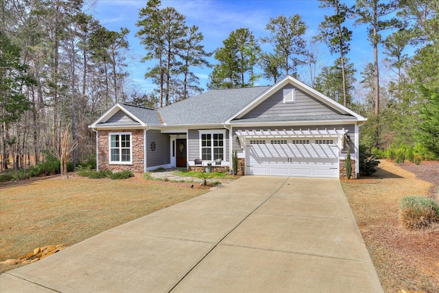 338 Pro Cir, Mccormick, SC 29835 - view of front of home featuring a front yard, a garage, stone siding, and driveway