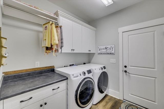 338 Pro Cir, Mccormick, SC 29835 - laundry area with cabinet space, washer and dryer, baseboards, and wood finished floors