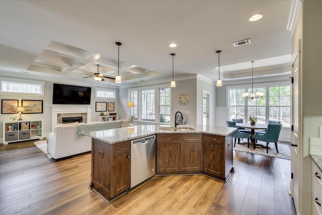 338 Pro Cir, Mccormick, SC 29835 - kitchen featuring visible vents, a fireplace, stainless steel dishwasher, light wood-style floors, and a sink