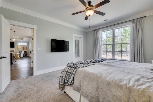338 Pro Cir, Mccormick, SC 29835 - carpeted bedroom featuring visible vents, a ceiling fan, baseboards, and ornamental molding