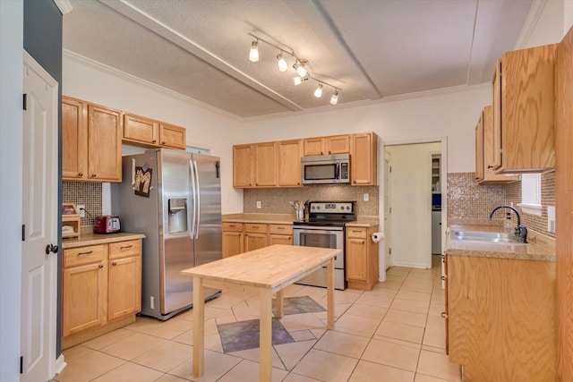 kitchen with backsplash, crown molding, sink, light brown cabinetry, and stainless steel appliances