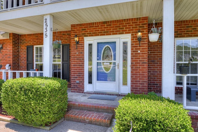 doorway to property featuring a porch