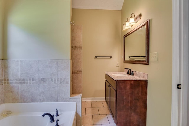 bathroom with tile patterned flooring, vanity, and a bathing tub