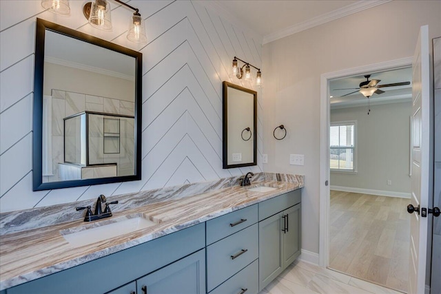 bathroom with walk in shower, ceiling fan, ornamental molding, and vanity