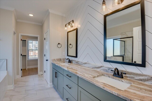 bathroom with crown molding, vanity, and plus walk in shower