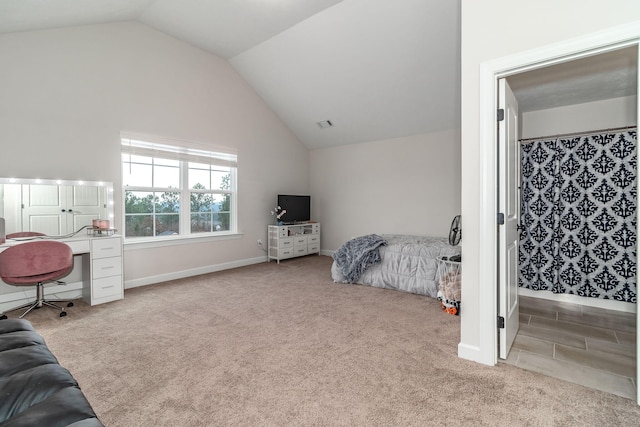 carpeted bedroom featuring vaulted ceiling