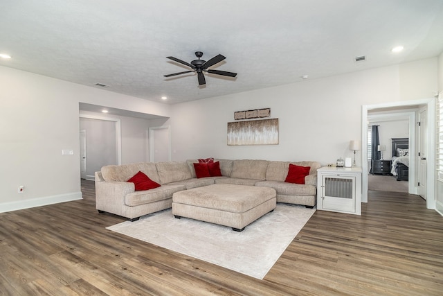 living room with hardwood / wood-style flooring and ceiling fan