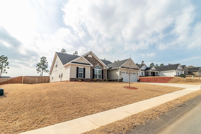 view of front facade with a garage and a front lawn