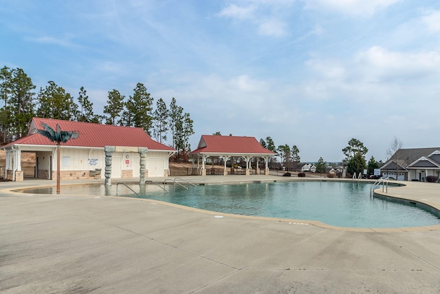 view of pool featuring a patio