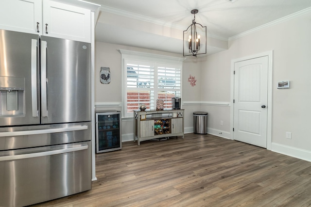 kitchen with beverage cooler, stainless steel fridge, dark hardwood / wood-style flooring, and white cabinets