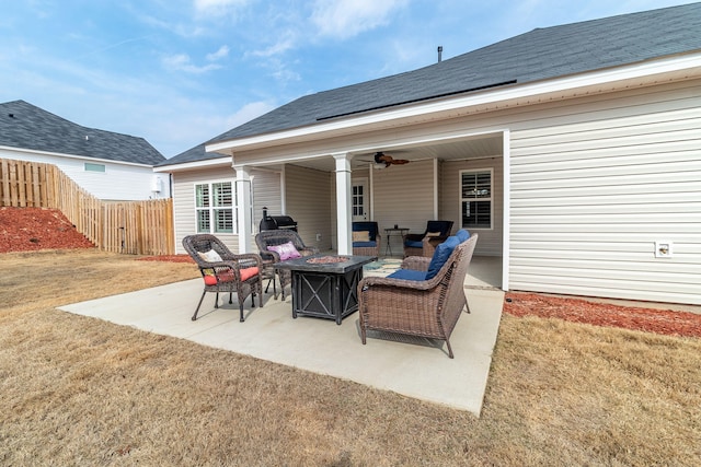 view of patio / terrace with an outdoor living space with a fire pit and ceiling fan