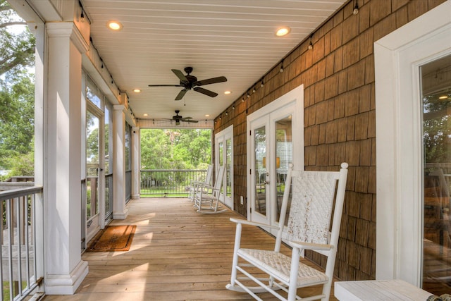 wooden deck featuring a ceiling fan and french doors