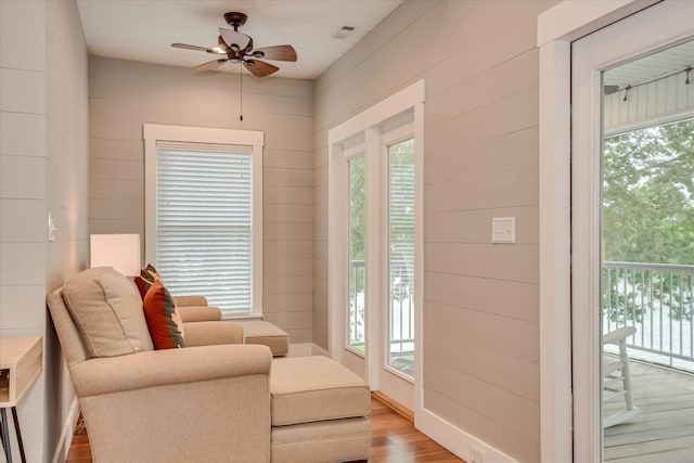 sitting room featuring ceiling fan and light wood-style flooring