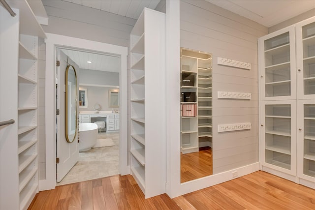 spacious closet featuring wood finished floors