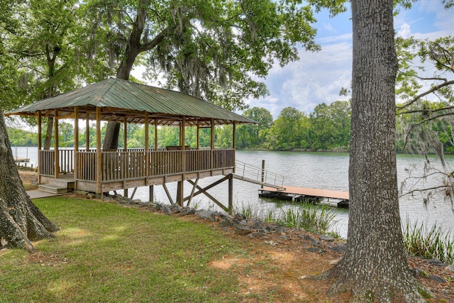 view of dock with a gazebo and a water view