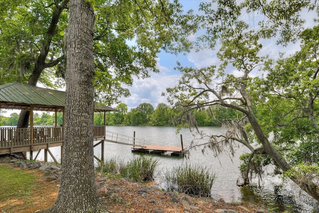 view of dock featuring a gazebo and a water view