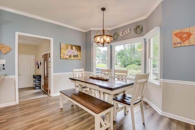 32 Creekside Dr, Aiken, SC 29803 - dining space with a chandelier, wood finished floors, baseboards, and ornamental molding