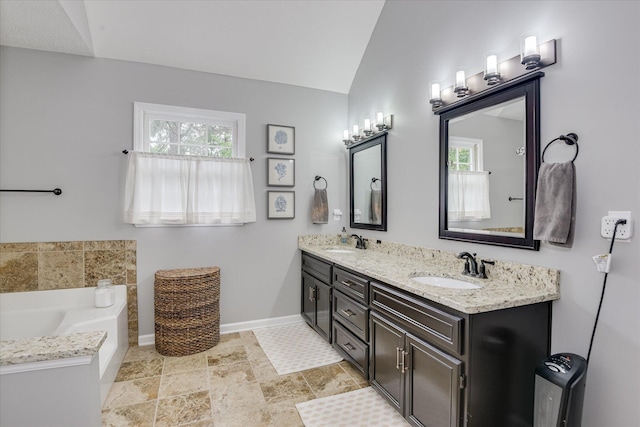32 Creekside Dr, Aiken, SC 29803 - full bath featuring double vanity, a bath, baseboards, and vaulted ceiling