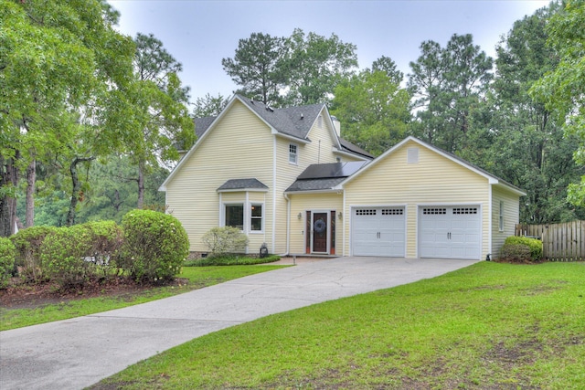 32 Creekside Dr, Aiken, SC 29803 - traditional home featuring an attached garage, solar panels, driveway, crawl space, and a shingled roof