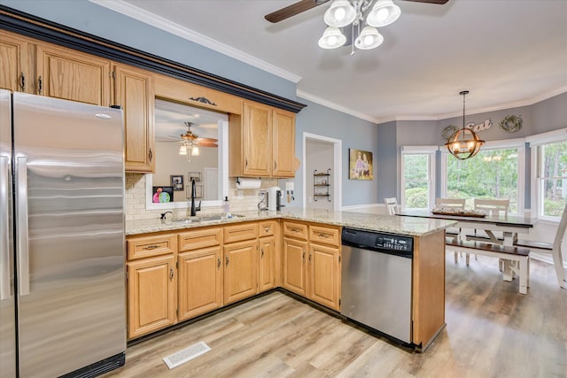 32 Creekside Dr, Aiken, SC 29803 - kitchen featuring stainless steel appliances, ceiling fan, a sink, light wood-type flooring, and ornamental molding