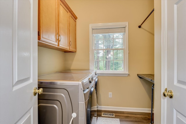 32 Creekside Dr, Aiken, SC 29803 - laundry room with cabinet space, washing machine and dryer, wood finished floors, and baseboards
