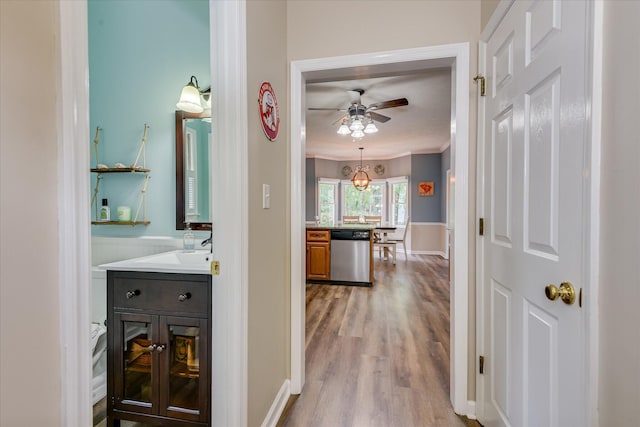32 Creekside Dr, Aiken, SC 29803 - hallway with wood finished floors, crown molding, and a sink