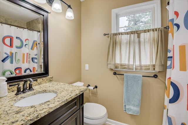 32 Creekside Dr, Aiken, SC 29803 - bathroom featuring toilet, vanity, baseboards, and a shower with shower curtain