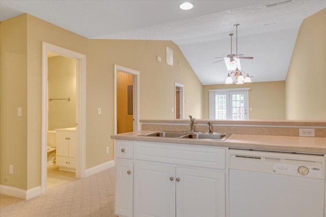 kitchen featuring a sink, dishwasher, a ceiling fan, white cabinetry, and lofted ceiling