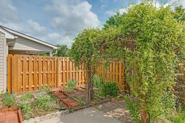 exterior space featuring fence and a patio