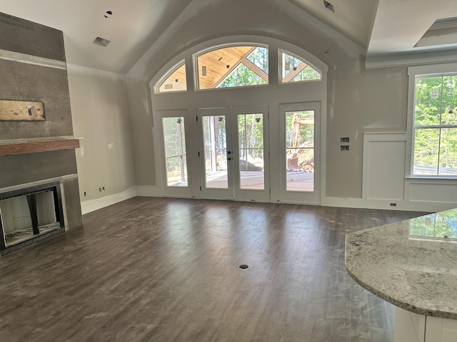 150 Shenandoah Dr, Mccormick, SC 29835 - unfurnished living room with lofted ceiling, french doors, wood finished floors, a fireplace, and baseboards