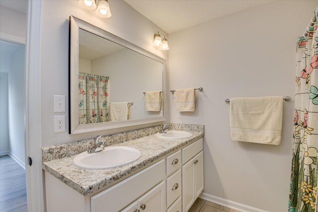 4932 Fairmont Dr, Graniteville, SC 29829 - full bath with a sink, baseboards, and double vanity